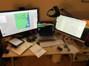 desk with RPG gaming stuff and computer